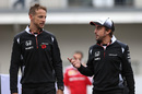Jenson Button and Fernando Alonso chat in the paddock
