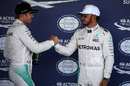 Lewis Hamilton and Nico Rosberg shake hands in parc ferme after qualifying
