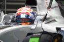 Romain Grosjean sits in the Haas cockpit