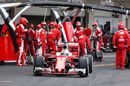 Sebastian Vettel makes a pit stop during the race