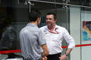 Eric Boullier talks with Esteban Ocon in the paddock