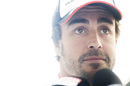 Fernando Alonso answers the questions in the paddock