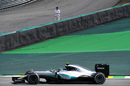 Fernando Alonso stopped on track during FP2 watches Nico Rosberg