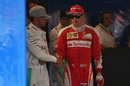 Lewis Hamilton and Kimi Raikkonen shake hands after qualifying