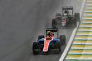 Esteban Ocon fights a position with Fernando Alonso