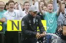 Lewis Hamilton celebrates with the team