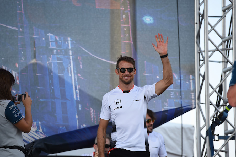 Jenson Button smiles during the event