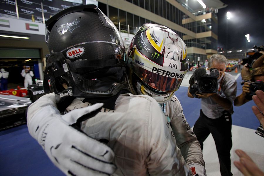 Nico Rosberg and Lewis Hamilton celebrate in parc ferme