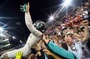 Nico Rosberg celebrates in parc ferme with the team