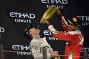 Sebastian Vettel congrats Nico Rosberg for his title on the podium