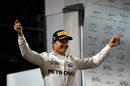 New World Champion Nico Rosberg celebrates on the podium