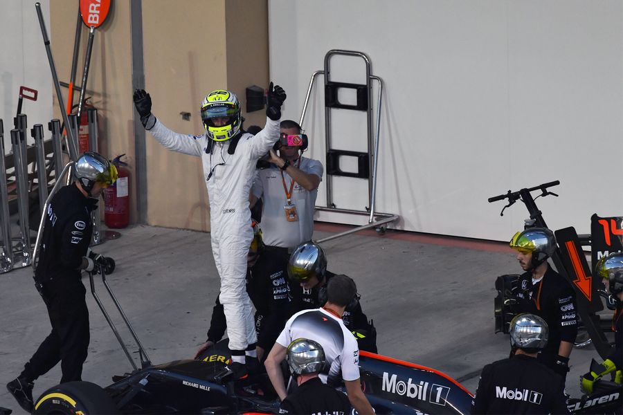Jenson Button waves to fans after his retirement from the race