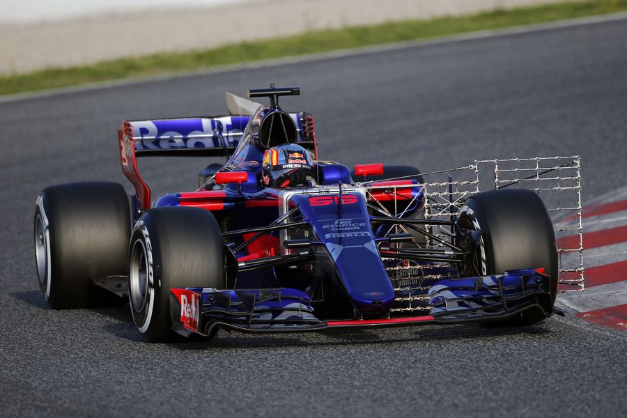 Carlos Sainz turns into the apex in the Scuderia Toro Rosso STR12