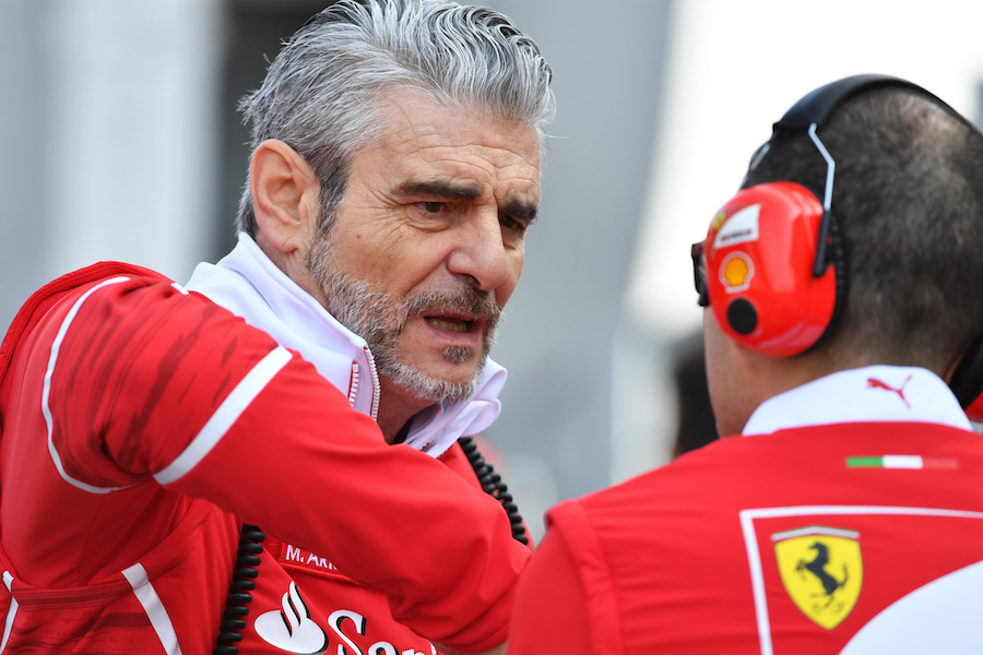 Maurizio Arrivabene talks with Ferrari engineers