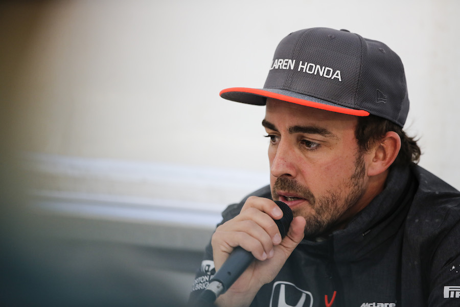 Fernando Alonso speaks with media after the session