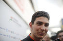 Esteban Ocon speaks with media after the session