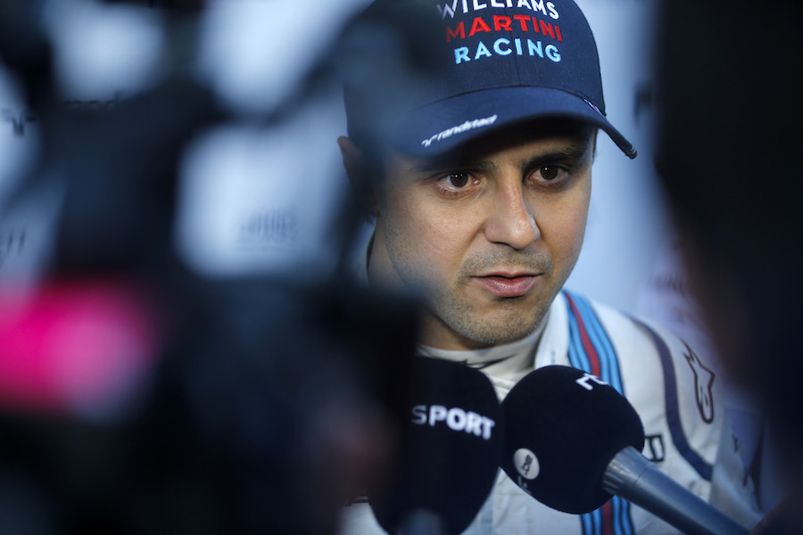 Felipe Massa talks with media after the session