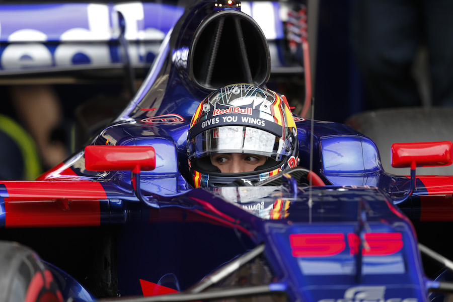 Carlos Sainz sits the cockpit of Toro Rosso