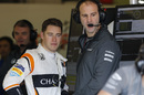 Stoffel Vandoorne talks with a McLaren mechanic