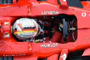 Sebastian Vettel sits in the cockpit of Ferrari