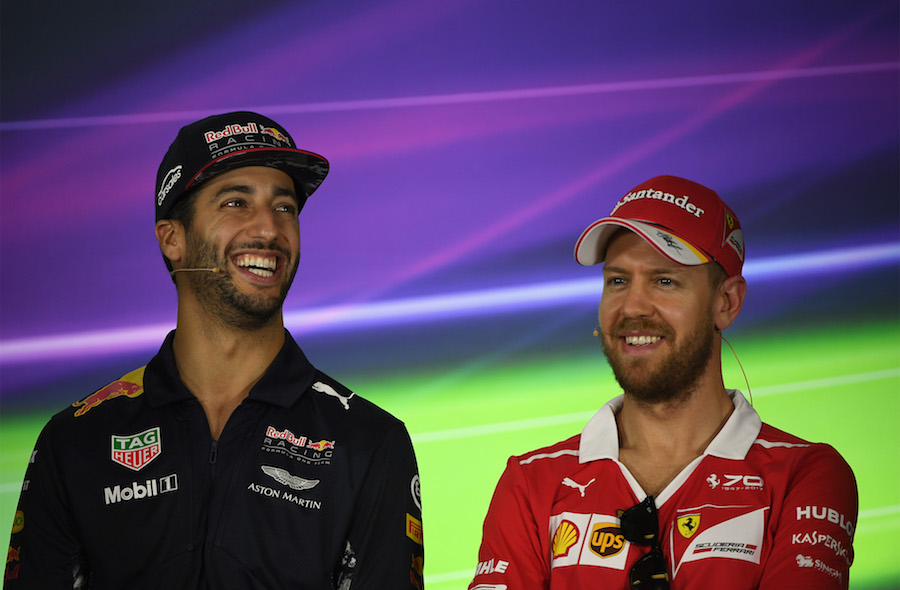 Daniel Ricciardo and Sebastian Vettel smile in the press conference