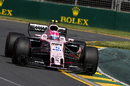 Esteban Ocon rides the kerb in his Force India