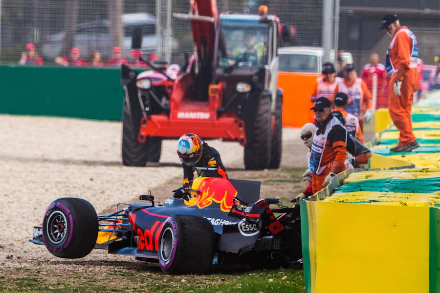 Daniel Ricciardo leaves his car after crashed in Q3