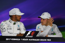 Valtteri Bottas speaks with Lewis Hamilton during the press conference
