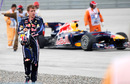 Sebastian Vettel walks away from his car after his collision with Mark Webber