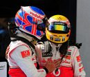 Jenson Button congratulates race winner Lewis Hamilton after a McLaren 1-2
