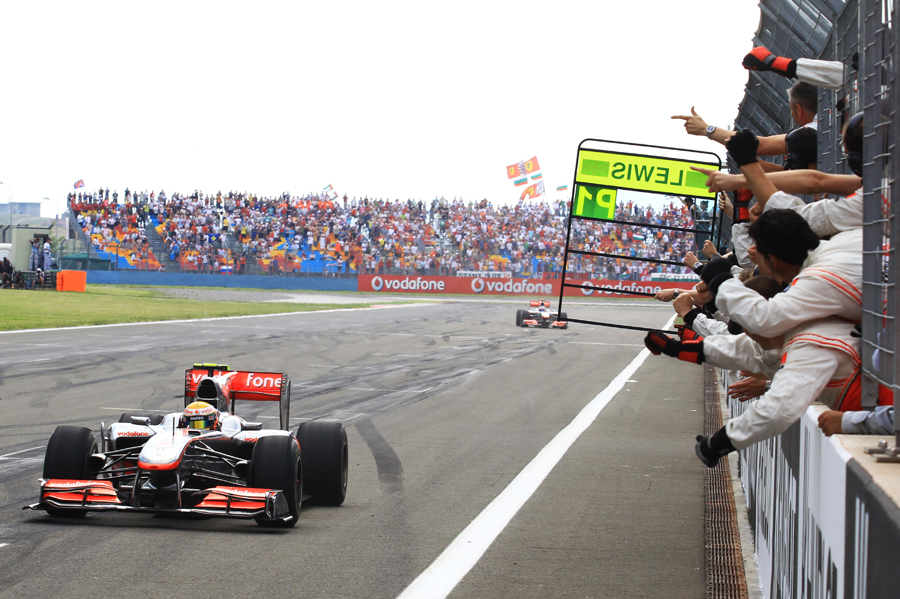 Lewis Hamilton crosses the line to take the win 