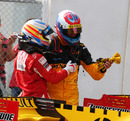 Fernando Alonso and Vitaly Petrov discuss their minor collision after the race