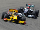 Robert Kubica leads Michael Schumacher on track
