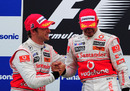 Jenson Button congratulates Lewis Hamilton on the podium