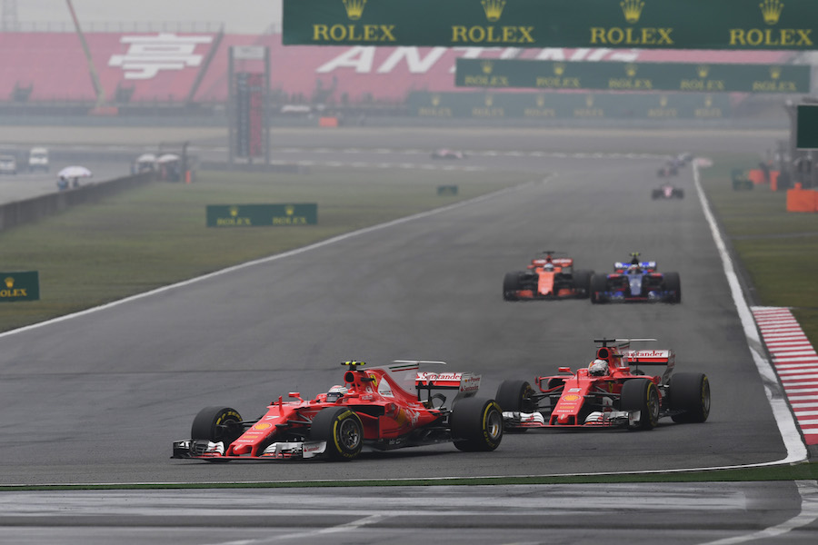 Kimi Raikkonen leads his teammate Sebastian Vettel