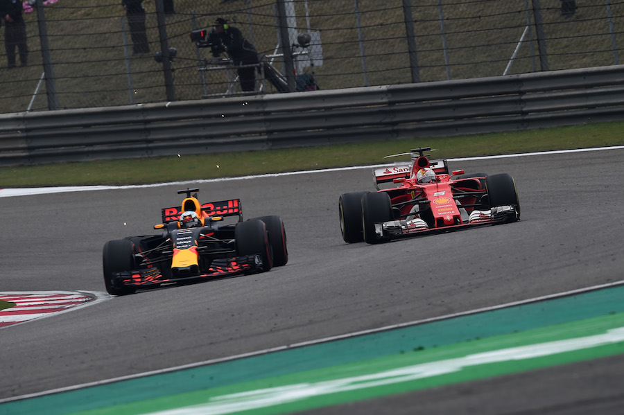 Daniel Ricciardo and Sebastian Vettel battle for a position