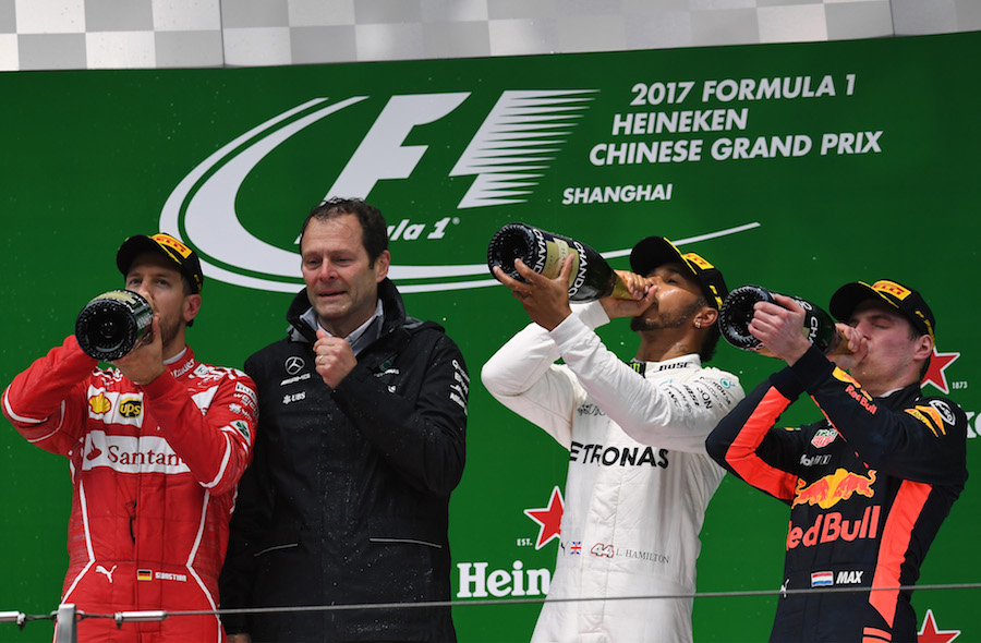 Top 3 drivers celebrate on the podium with the champagne