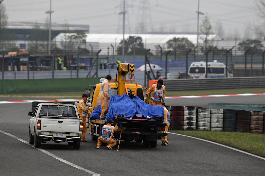 Daniil Kvyat's Toro Rosso is recovered by marshalls