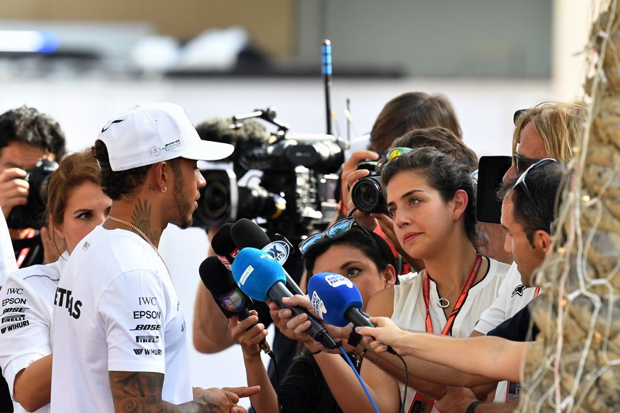 Lewis Hamilton talks with the media