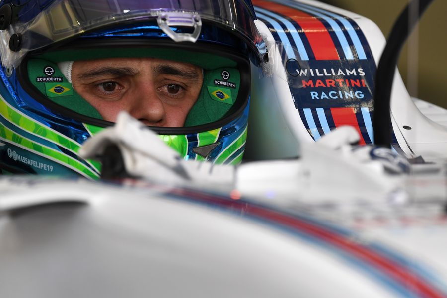 Felipe Massa sits in the Williams cockpit in the garage
