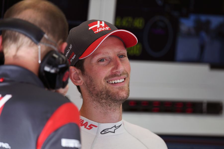 Romain Grosjean relaxes in the garage