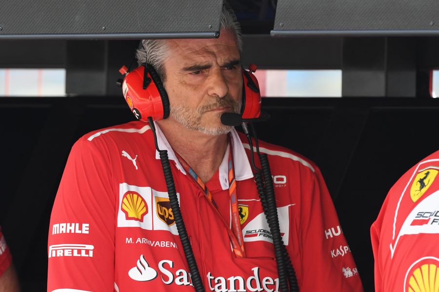 Maurizio Arrivabene sits in the Ferrari cockpit