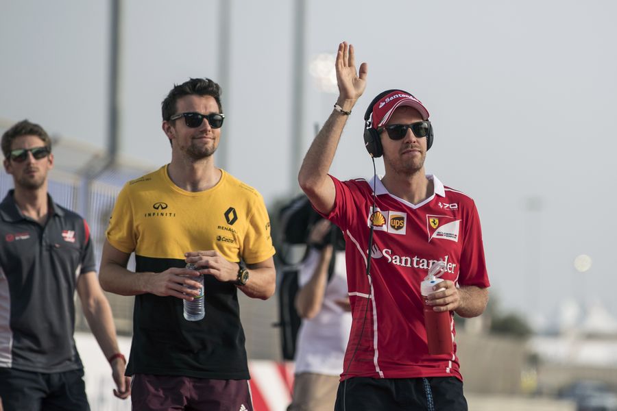 Sebastian Vettel and Jolyon Palmer enjoy the drivers parade