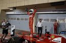 Sebastian Vettel cerebrates on the palc ferme