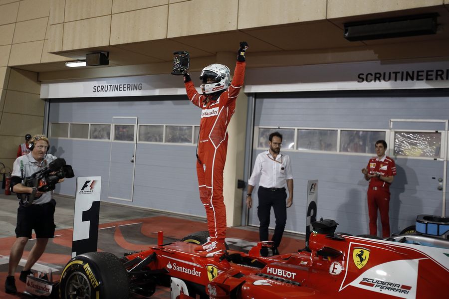 Sebastian Vettel cerebrates on the palc ferme