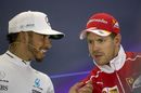 Lewis Hamilton talks with Sebastian Vettel in the press conference