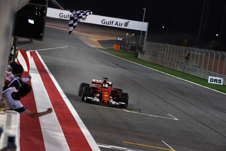 Sebastian Vettel takes the chequered flag