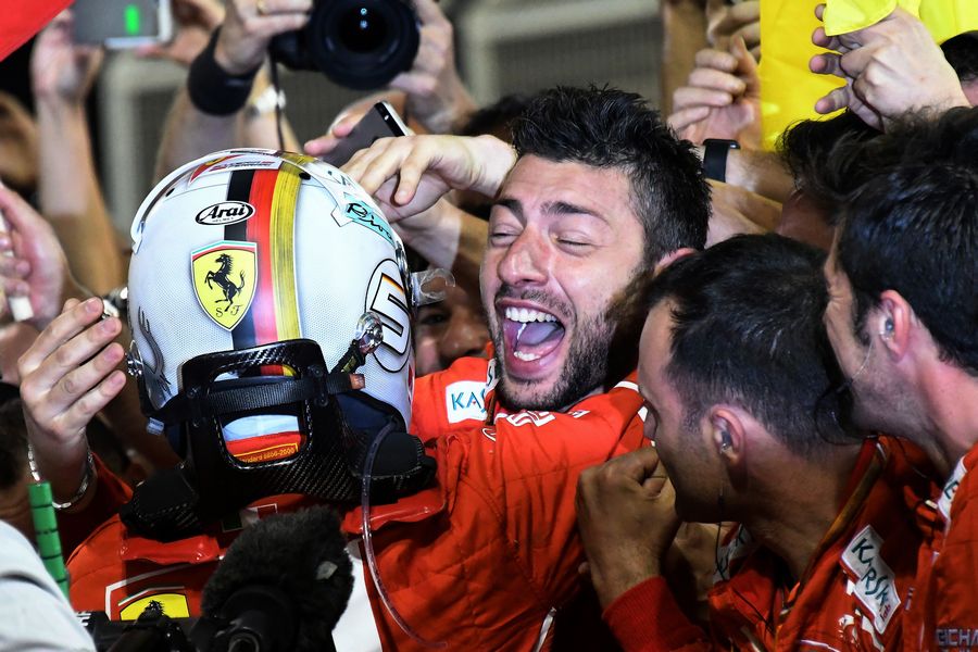 Sebastian Vettel cerebrates with Ferrari