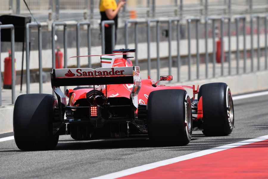 Antonio Giovinazzi powers down the pit lane in the Ferrari