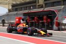 Daniel Ricciardo powers down the pit lane in the Red Bull
